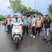 Wali Kota Jambi Maulana saat menjajal sepeda motor listrik di arena Walikota Cup Race 2026, Minggu (3/5/2026). (Dok. Sinsen)